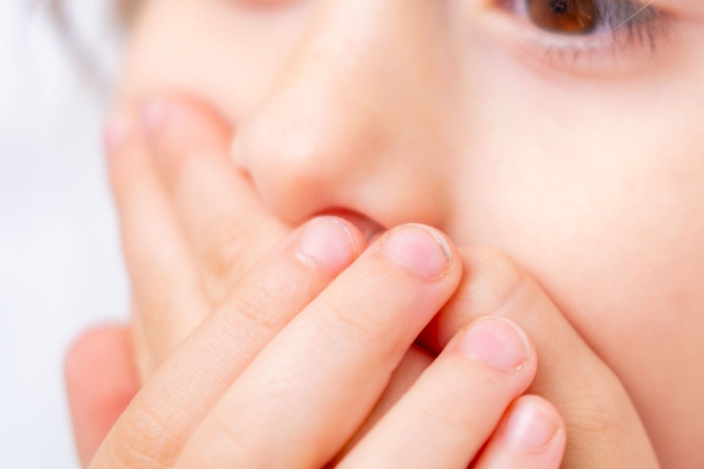 child covering mouth with hands, expressing fear speaking, shyness, social anxiety, struggle begin articulation, expressing silence, suppress cough or sneeze, Childhood shyness and secret keeping